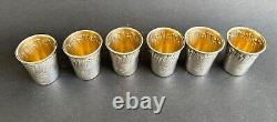 Translation: 'Set of 6 antique sterling silver liqueur glass cups by a silversmith'