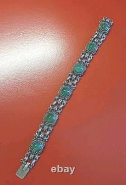 Very beautiful antique articulated bracelet in solid silver and green cabochons