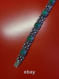 Very beautiful antique articulated bracelet in solid silver and green cabochons