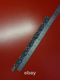Very beautiful antique articulated bracelet in solid silver and green cabochons