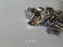 Ancien bracelet en argent massif Charms Articulés