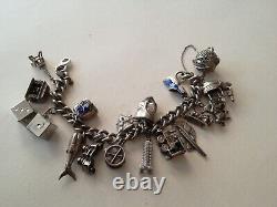 Ancien bracelet en argent massif Charms Articulés