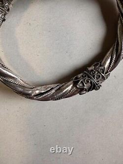 Ancien bracelet jonc en argent massif poinçon 925, têtes de béliers, poids 42.63