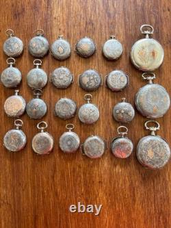 Argent massif et décoration or. 23 Boitiers de montres anciennes. Total 236 gr