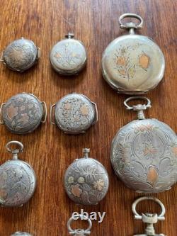 Argent massif et décoration or. 23 Boitiers de montres anciennes. Total 236 gr