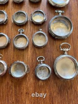 Argent massif et décoration or. 23 Boitiers de montres anciennes. Total 236 gr