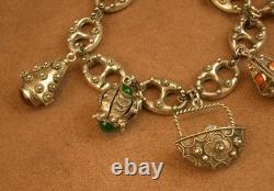 Beau bracelet a breloques ancien en argent massif, maille grain de café
