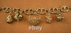 Beau bracelet a breloques ancien en argent massif, maille grain de café