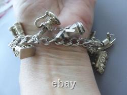 Bracelet ancien argent massif poinçons 13 breloques divers 36gr env. 18cm env
