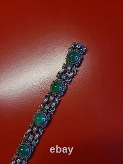 Très beau ancien bracelet articulé en argent massif et cabochons vert sanglier